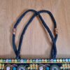 Bolsa indiana de tecido retangular com bordado floral preto e color
