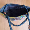 Bolsa indiana de tecido retangular com bordado floral preto e color