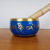 Tigela tibetana com 7 ligas de metal 10cm azul e dourada com almofada