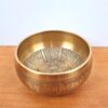 Tigela tibetana com 7 ligas de metal 14cm dourada de Buda