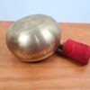Tigela tibetana com 7 ligas de metal 14cm dourada de Buda