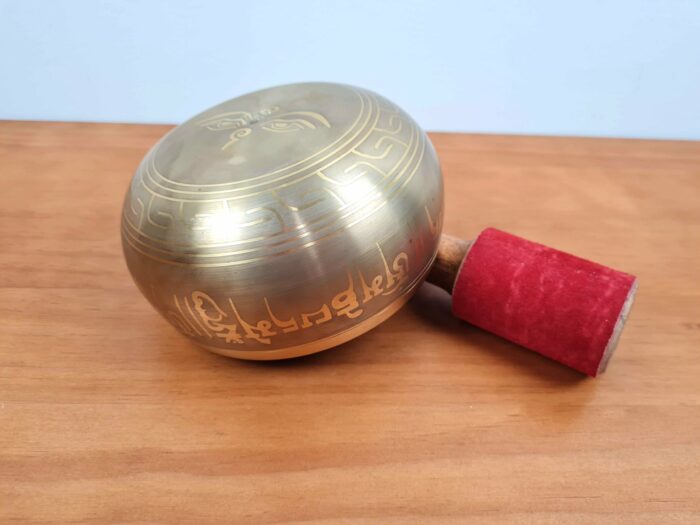 Tigela tibetana com 7 ligas de metal 14cm dourada de Buda