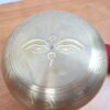 Tigela tibetana com 7 ligas de metal 14cm dourada de Buda