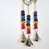 Sino dos ventos de metal com símbolo do Om e 7 chakras