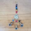 sino dos ventos ou móbile de Ganesha em metal dourado com pedras dos 7 chakras