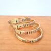 20230524_190626 Conjunto de 4 pulseiras indianas douradas com pedrinhas