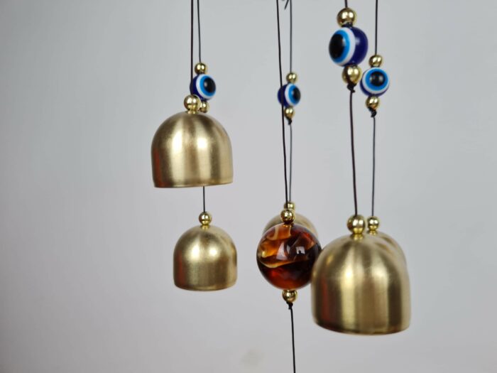 Sino dos ventos de metal com imagem de Ganesha e pedras de Olho Grego 55cm