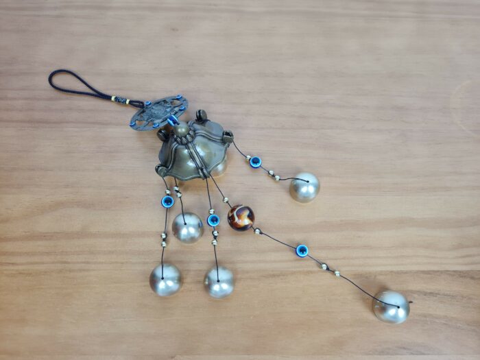 Sino dos ventos de metal com imagem de Ganesha e pedras de Olho Grego 55cm