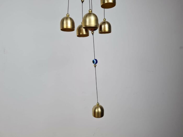 Sino dos ventos de metal com imagem de Ganesha e pedras de Olho Grego 55cm