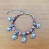 Pulseira de prata alemã com elefantinhos e contas vermelhas