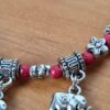 Pulseira de prata alemã com elefantinhos e contas vermelhas
