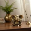 Estátua do Deus Ganesha em metal brass com doce laddu nas mãos