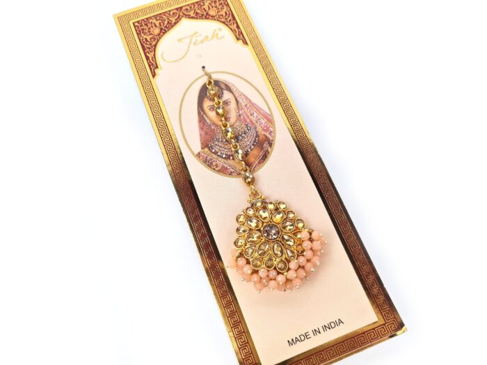Tikka joia indiana de testa dourado com pedrarias rosa claro
